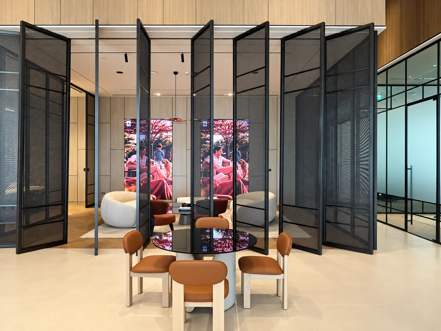 Tall black metal mesh divider panels in a contemporary interior